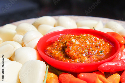 Indonesian garlic chilli sambal or sambel bawang with garlic, chilli and salt as Ingredients. authentic traditional sambal or chilli paste from indonesia. photo