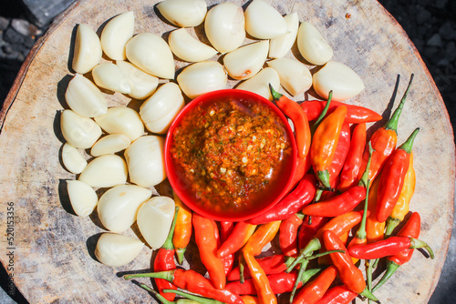Indonesian garlic chilli sambal or sambel bawang with garlic, chilli and salt as Ingredients. authentic traditional sambal or chilli paste from indonesia. photo