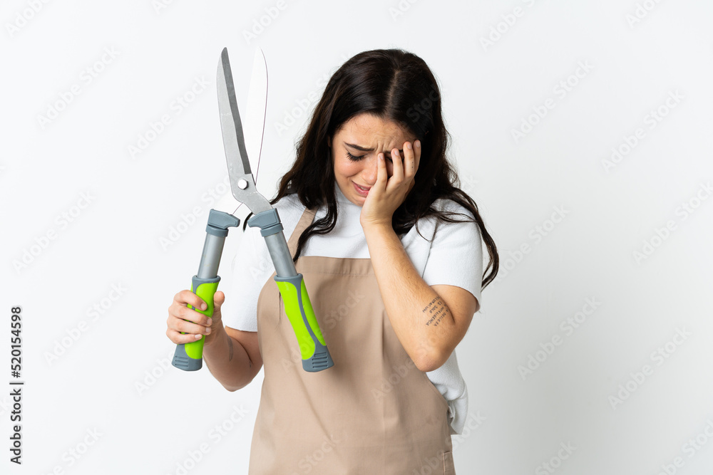 Young caucasian woman holding a plant isolated on white background with tired and sick expression Young caucasian woman holding a plant isolated on white background with tired and sick expression