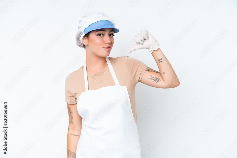 Fishmonger wearing an apron and holding a raw fish isolated on white background proud and self-satisfied Fishmonger wearing an apron and holding a raw fish isolated on white background proud and self-satisfied