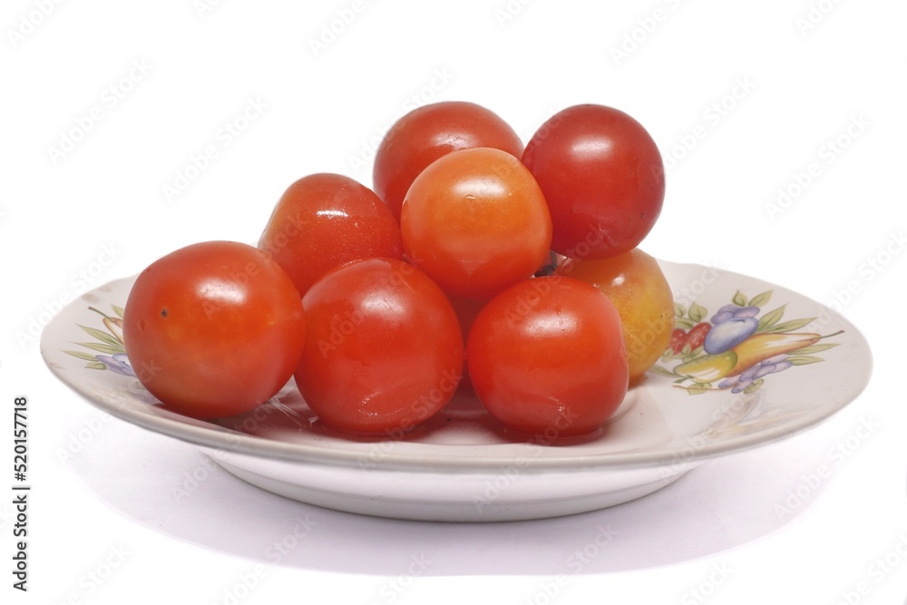 white background bright red tomatoes placed in a white plate white background bright red tomatoes placed in a white plate