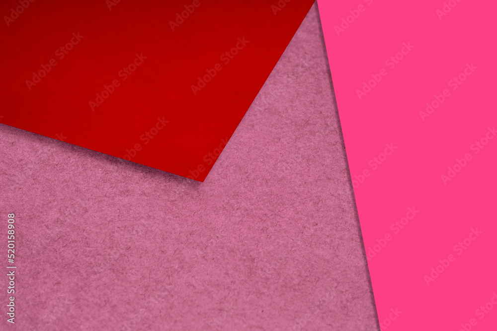 Plain and Textured neon red pink peach papers randomly laying to form M like pattern and triangle for creative cover design idea Plain and Textured neon red pink peach papers randomly laying to form M like pattern and triangle for creative cover design idea