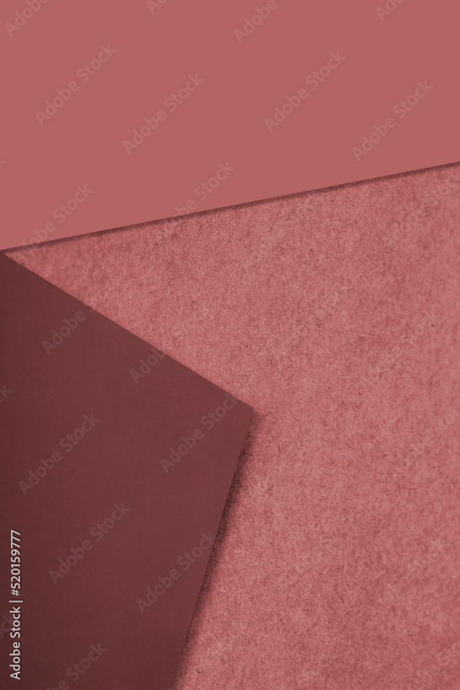 Plain and Textured tan red brown papers randomly laying to form M like pattern and vertical triangle for creative cover design idea Plain and Textured tan red brown papers randomly laying to form M like pattern and vertical triangle for creative cover design idea