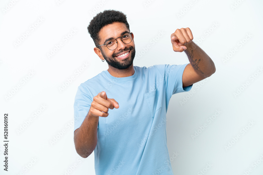 Fototapeta premium Young Brazilian man isolated on white background pointing front with happy expression