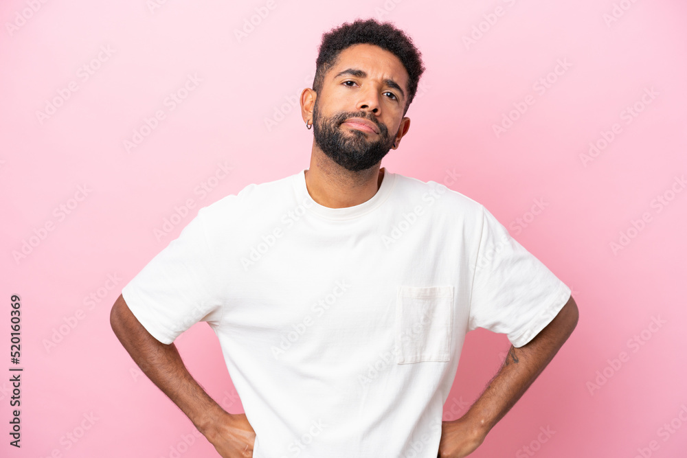 Young Brazilian man isolated on pink background angry Young Brazilian man isolated on pink background angry