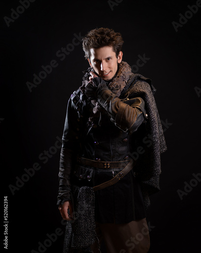 A guy in a steampunk or post-apocalyptic image, portrait on a black background
