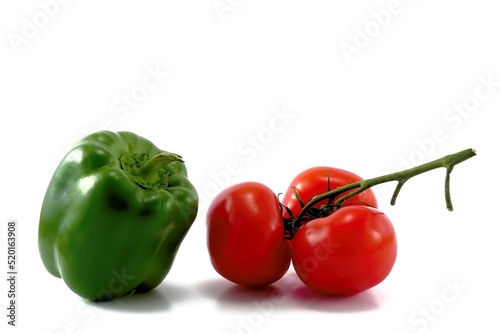 Tomato and green pepper vegetables isolated on white background 