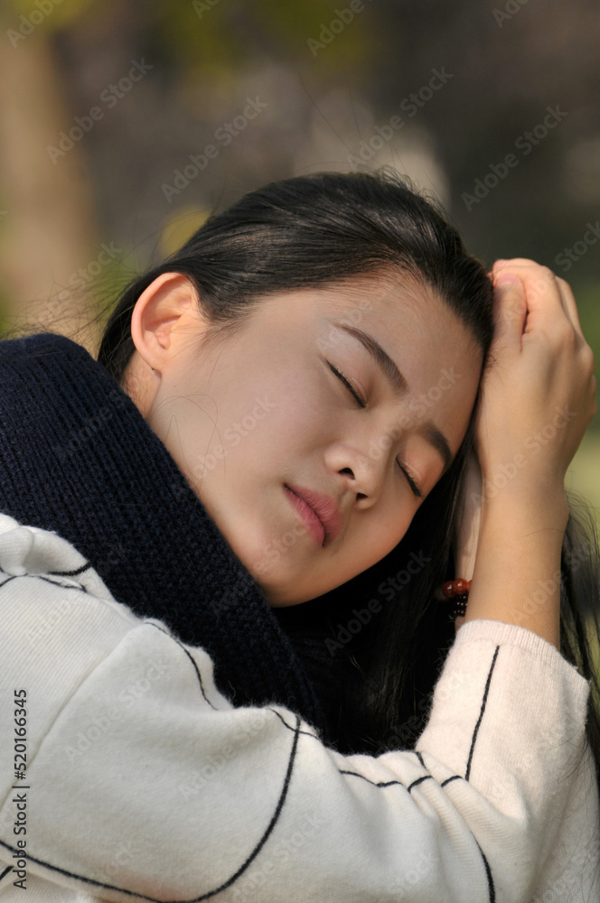 Chinese girl is playing at park Chinese girl is playing at park