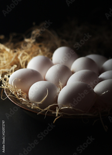 Chicken eggs in rustic style low key	