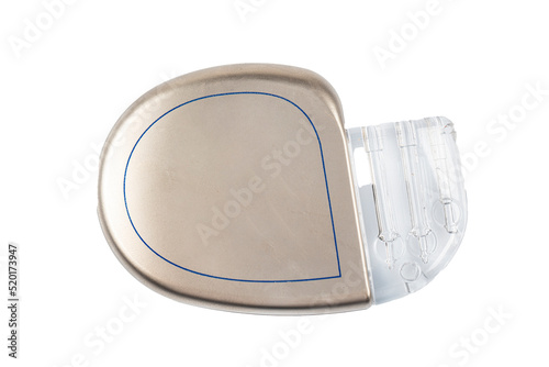 Pacemaker isolated on a white background. Heart battery. Close-up of cardiac pacemaker on electrocardiography. photo