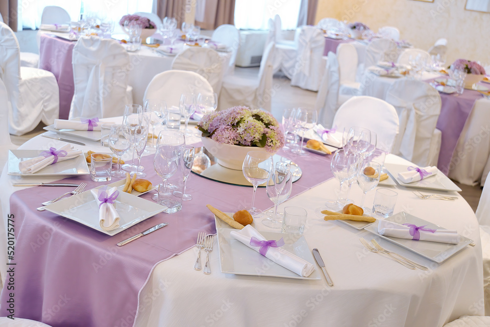 Detail of a table set in pink for a wedding banquet Detail of a table set in pink for a wedding banquet