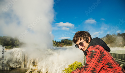 people in geothermal volcanic park with geysers and hot streams, scenic landscape, te piua national park, rotorua, new zealand. High quality photo