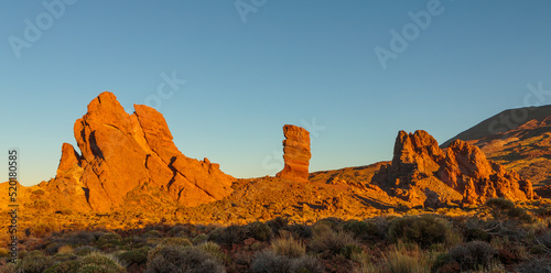 Panorama of the Los Roques de Garcia volcanic rock formations in the caldera of the El Teide strato volcano at sunrise, Tenerife, Spain photo