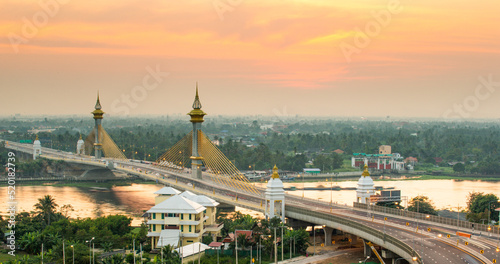 Sunset over Maha Chesadabodindranusorn Bridge (Ninthaburi bridge)  in the evening. The bridge over the Chao Phraya river in Nonthaburi, Thailand.