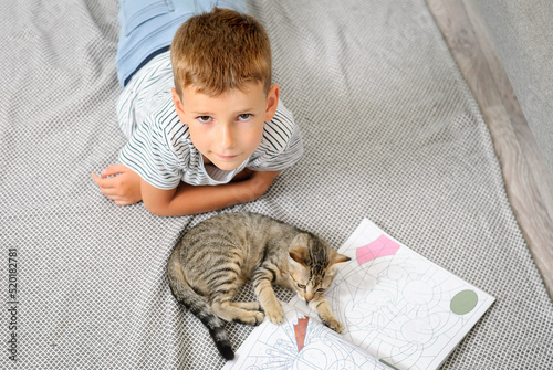 little child playing with a cat