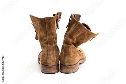 Old used leather Women's boots  isolated on white background.