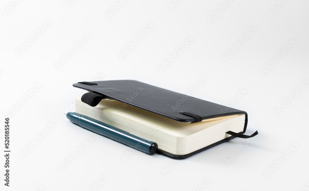 Notebook and pen on white background Notebook and pen on white background