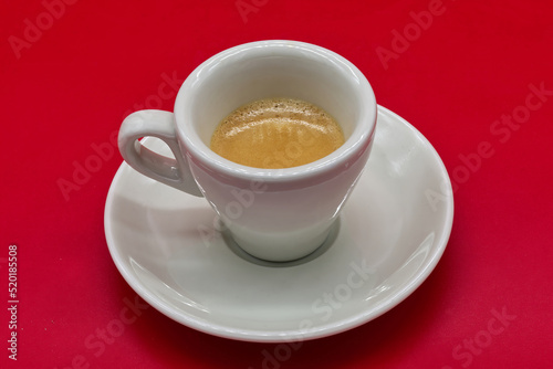 Classic Italian Espresso Coffee isolated on red background. Bologna, Italy.
