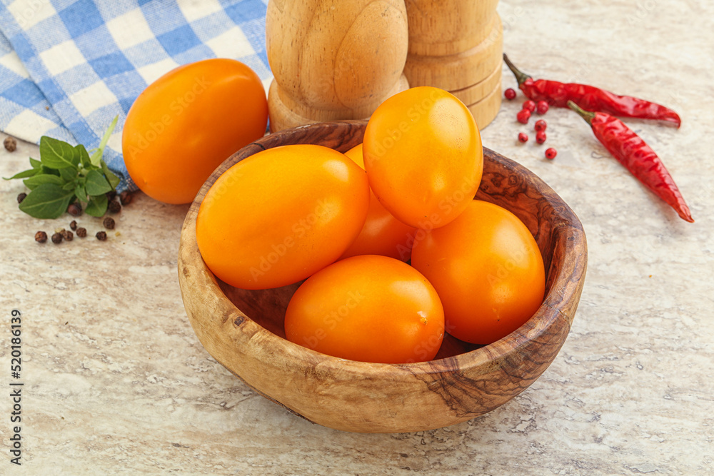 Sweet ripe yellow tomato in the bowl Sweet ripe yellow tomato in the bowl