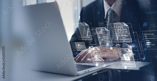 Wall Mural Businessman working with business analytics and data management system on computer connecting to database