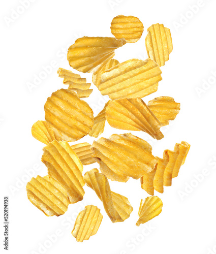 Ridged crispy potato chips flying on white background