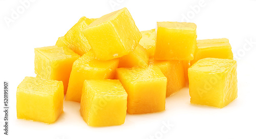 Juicy mango cubes isolated on white background.
