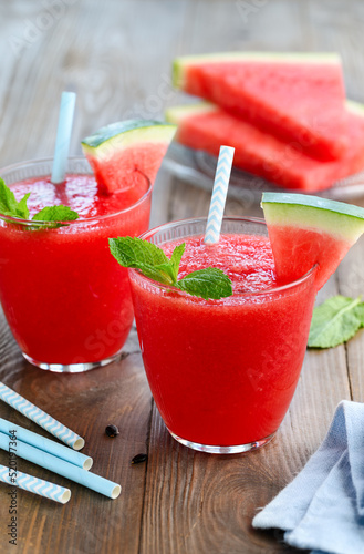 Watermelon smoothie in glasses with mint. Freshly squeezed juice. Refreshing summer drink. Vegetarian healthy food. Selective focus
