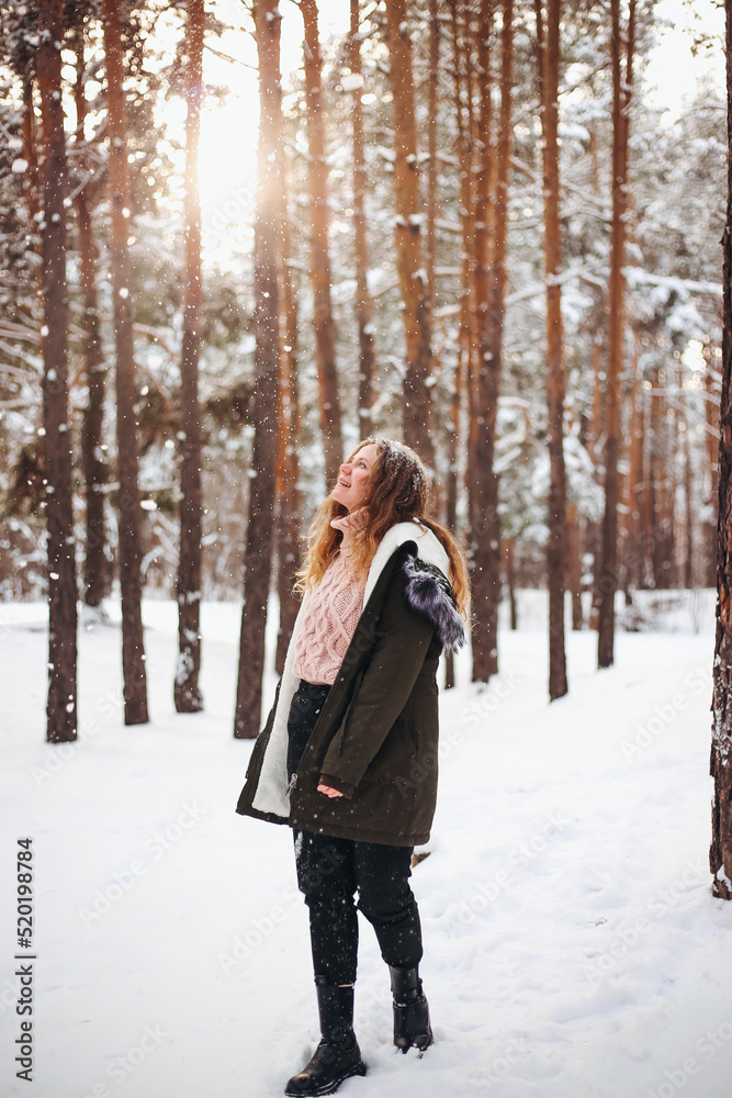 Girl woman and cat sitting on her shoulder in snowy winter forest Girl woman and cat sitting on her shoulder in snowy winter forest