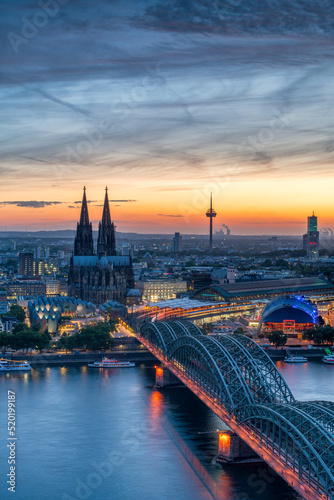 Cologne skyline at sunset with view of Cologne Cathedral and Hohenzollern Bridge, North Rhine-Westphalia, Germany