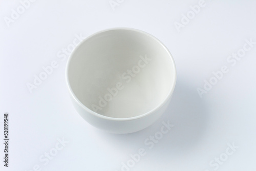 White plate isolated on white background  flat lay  top view.