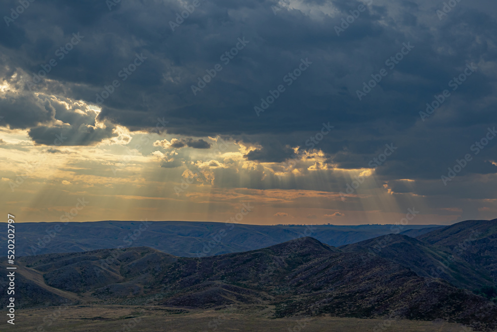 Mountains and clouds at sunset. Soft focus