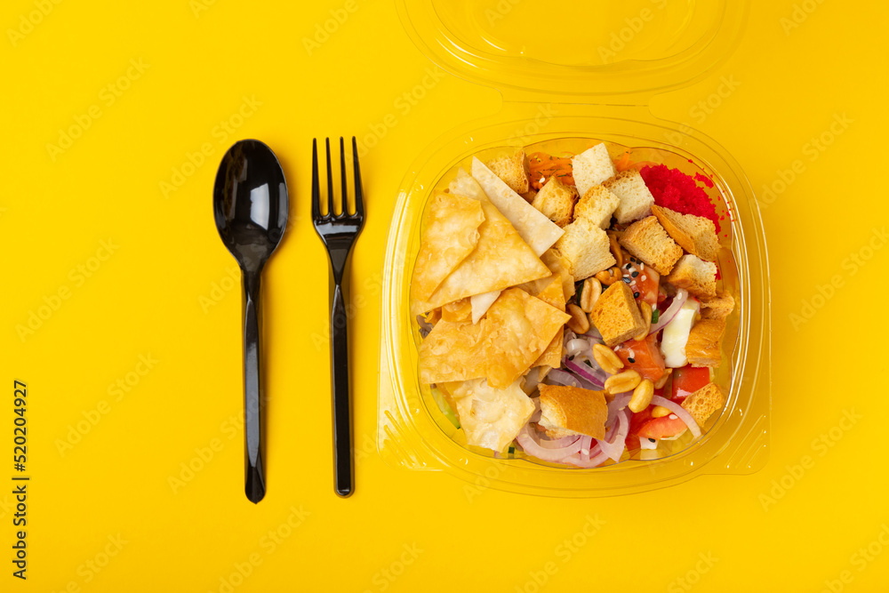 Poke from salmon, funchose, vegetables and pita crispy on a yellow-orange background.Healthy healthy food.Hawaiian food. View from above. Place to copy. Poke from salmon, funchose, vegetables and pita crispy on a yellow-orange background.Healthy healthy food.Hawaiian food. View from above. Place to copy.