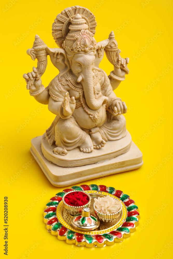 Lord Ganesha Sculpture on yellow background. Lord Ganesha Sculpture on yellow background.