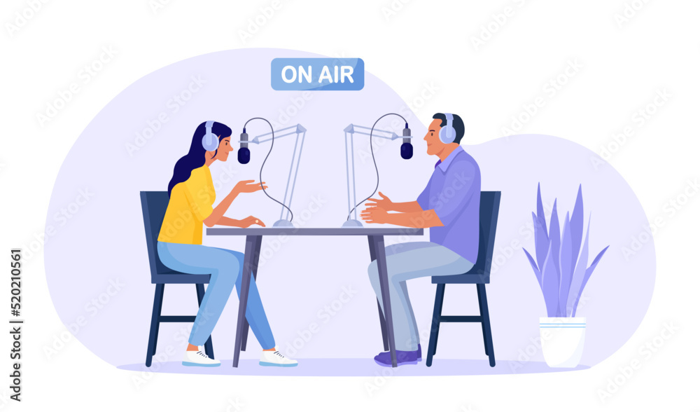 Radio host interviewing guests on radio station. Man and woman in headphones talking to microphones recording podcast in studio. Mass media broadcasting Radio host interviewing guests on radio station. Man and woman in headphones talking to microphones recording podcast in studio. Mass media broadcasting