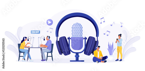 People recording podcast in radio studio. Female radio host interviewing guest with microphone. Man and woman in headphones talking. Mass media broadcasting. People listening music in headset