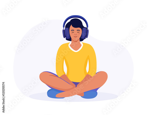 Woman meditating in the Lotus position. Girl with headphones practising guided meditation. Podcast. Online training, radio. Character with headphone listens  music and enjoys songs in earphones