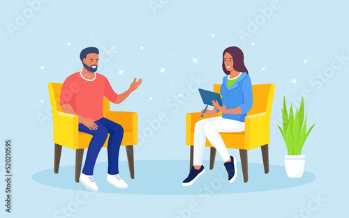Psychotherapy counseling. Psychologist or psychotherapist and patient sitting in armchairs in therapy session. Treatment of stress, addictions and mental problems.
