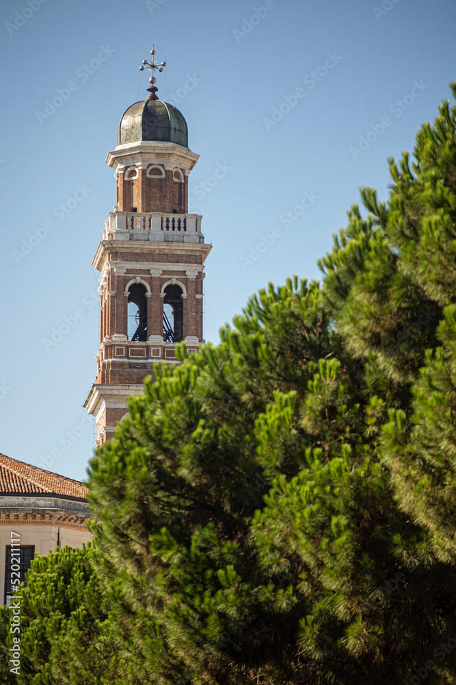 Church bell tower in the trees