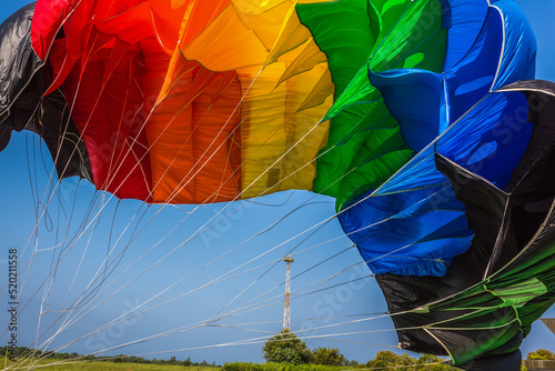 Abлhazia Sukhum Babushara 09.14.2017 Canopy of colorful parachute in blue sky. A background with an abstract view of a colorful parachute. Parachute jumps. Active life style.