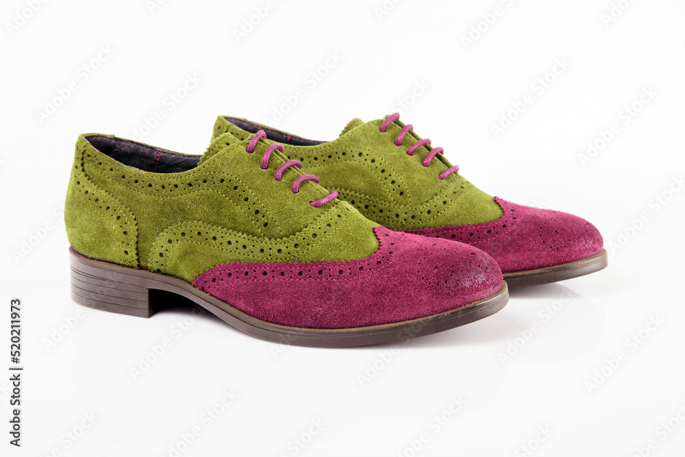 Male pink and green leather shoe on white background, isolated product.