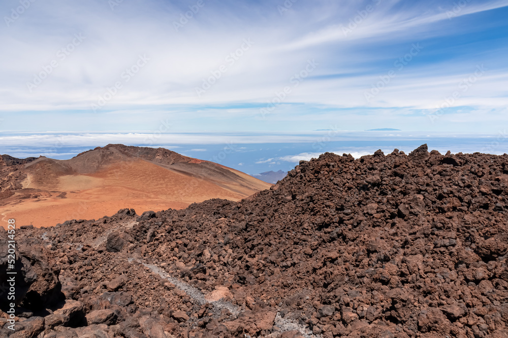 Panoramic view on crater of mountain Pico Viejo on hiking trail to volcano Pico del Teide, Mount Teide National Park, Tenerife, Canary Islands, Spain, Europe. Walking on barren volcanic desert terrain Panoramic view on crater of mountain Pico Viejo on hiking trail to volcano Pico del Teide, Mount Teide National Park, Tenerife, Canary Islands, Spain, Europe. Walking on barren volcanic desert terrain