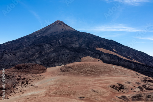Hiking trail over volcanic desert terrain leading to summit of volcano Pico del Teide from Pico Viejo  Mount Teide National Park  Tenerife  Canary Islands  Spain  Europe. Solidified lava  ash  pumice