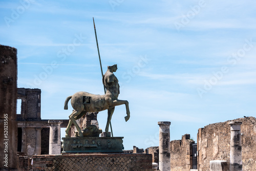 POMPEII, ITALY - MAY 04, 2022 - Beautiful statue of an ancient lancer on the forum of the ancient city of Pompeii, Italy photo