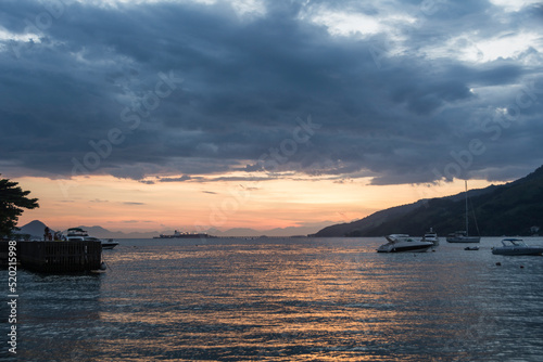 Sunset in a beach near the town of Angra dos Reis, State of Rio de Janeiro, Brazil. Taken with Nikon D7100 18-200 lens, at 28mm, 1/50 f 4.0 ISO 100. Date: Feb 09, 2016 photo