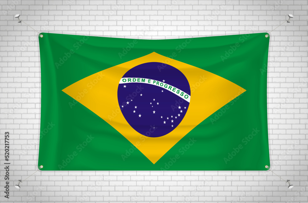 Obraz premium Brazil flag hanging on brick wall. 3D drawing. Flag attached to the wall. Neatly drawing in groups on separate layers for easy editing.