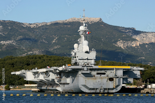 R91 Charles de Gaulle is an aircraft carrier of the French Navy seen here docked in the naval port at Toulon, France photo