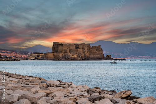 Sunrise over iconic Castel dell'Ovo and the Gulf of Naples, Italy photo