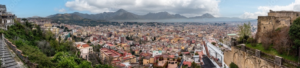 Panoramic view of Napoli's city center, mountains in the background