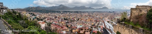Panoramic view of Napoli's city center, mountains in the background