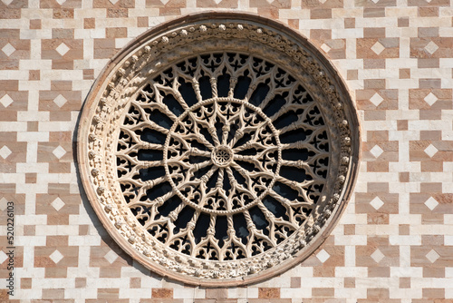 Typical Romanesque rose window of the portal of Basilica Santa Maria di Collemaggio in L'Aquila, Italy